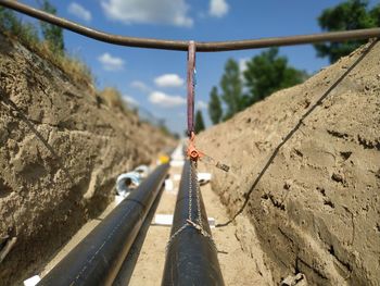 District heating pipes and chain hoist in dig near berlin