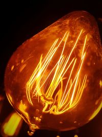 Close-up of illuminated light bulb