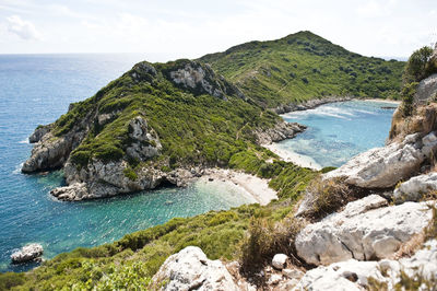 Scenic view of sea and rocks against sky