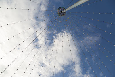 Low angle view of broken glass against sky