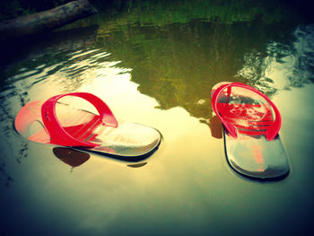 Close-up of sunglasses on lake