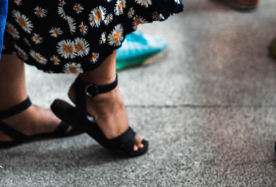 Low section of woman standing on floor