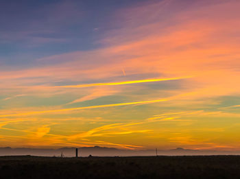 Scenic view of dramatic sky during sunset