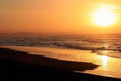 Scenic view of beach during sunset