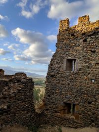 Low angle view of old building against sky