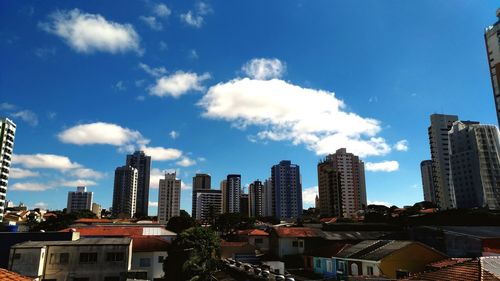 Buildings in city against sky