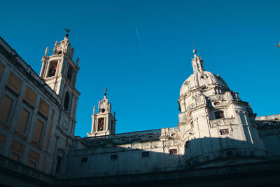 Low angle view of building against blue sky