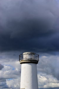 Low angle view of water tower against sky