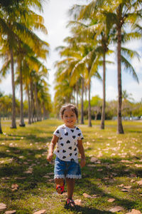 Portrait of boy standing on field