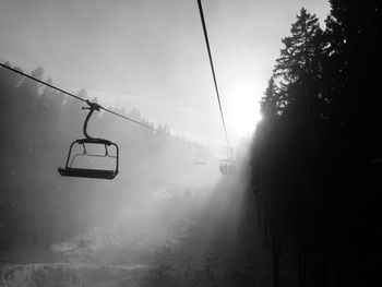 Overhead cable car against sky during winter