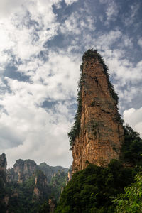 Low angle view of rock formation against sky