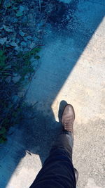 Low section of man standing on floor