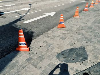 High angle view of arrow sign on road in city