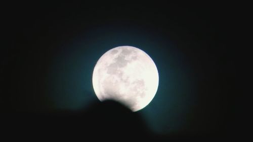 Low angle view of full moon against clear sky