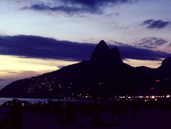 Silhouette of people at sunset