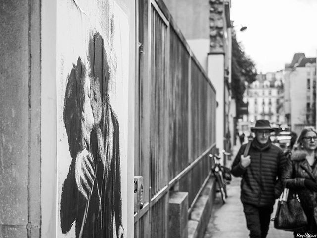 building exterior, architecture, built structure, men, lifestyles, rear view, person, city, street, leisure activity, walking, full length, casual clothing, day, focus on foreground, incidental people, building