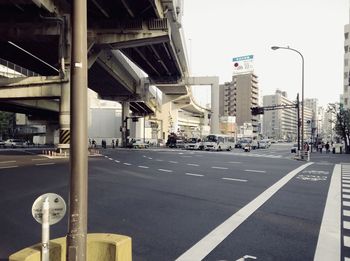 Vehicles on road along buildings