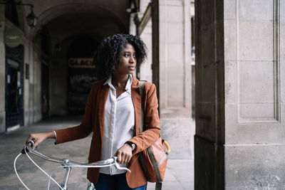 Full length of woman standing in city