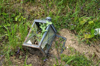 Old abandoned car on field