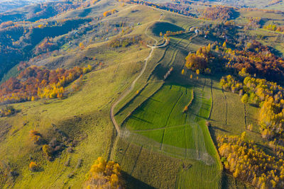 Aerial drone shot over autumn scenery in transylvania, romania