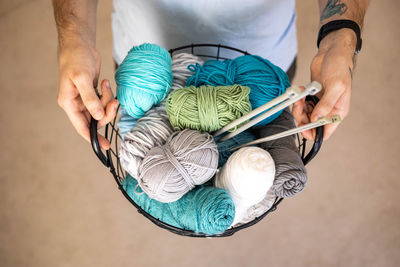 Midsection of man holding knife