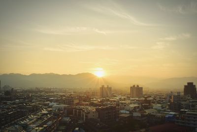 High angle view of cityscape against sky during sunrise