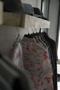 Close-up of clothes hanging in store