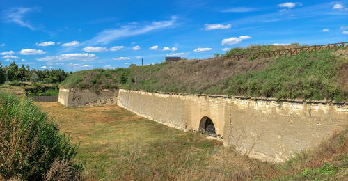 Shaft and moat of the tighina fortress in bender, transnistria or moldova, on a sunny summer day