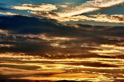 Low angle view of dramatic sky during sunset