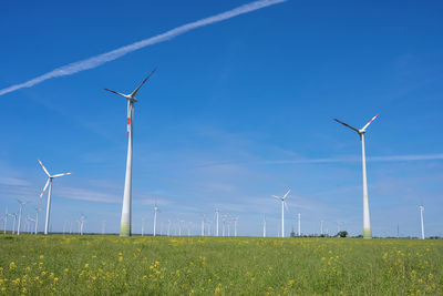 Modern wind wheels with a clear blue sky seen in germany