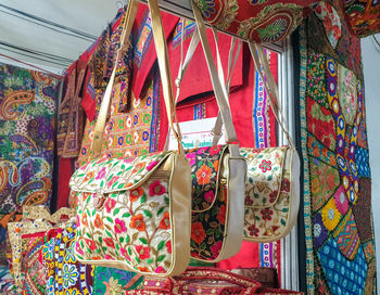 Multi colored umbrellas hanging at market stall