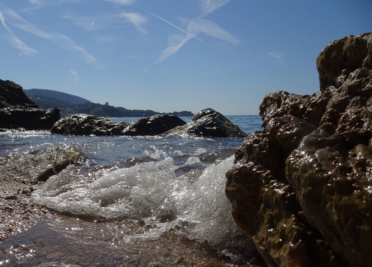 water, rock, sky, sea, coast, nature, scenics - nature, land, ocean, beauty in nature, shore, mountain, environment, wave, beach, landscape, body of water, no people, cloud, travel destinations, travel, motion, outdoors, cliff, day, tranquility, blue, terrain, coastline, sports, tranquil scene, non-urban scene