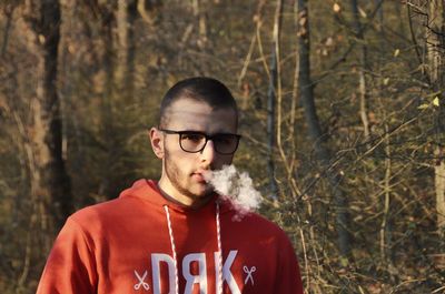 Portrait of young man in forest