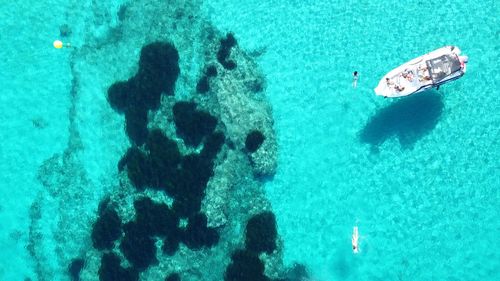 High angle view of people swimming in sea