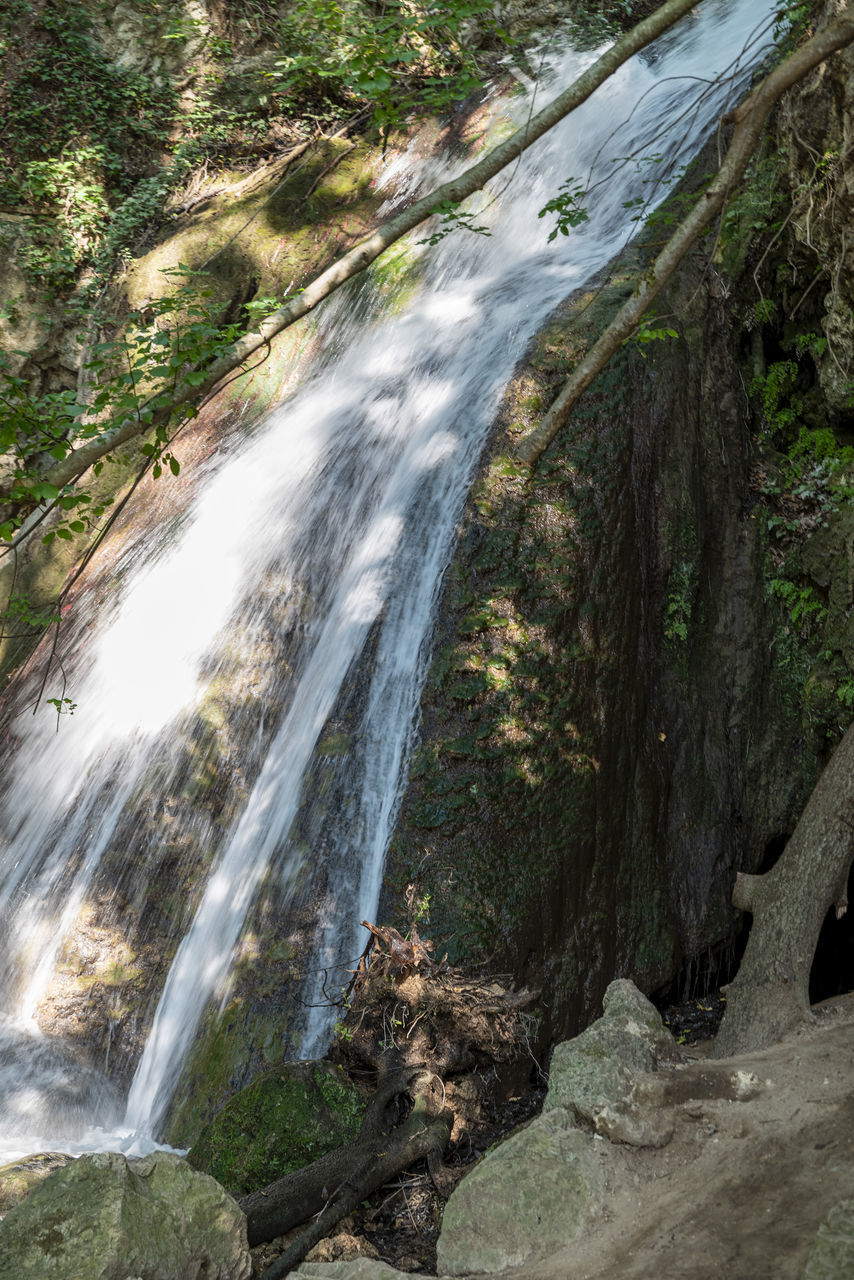 waterfall, beauty in nature, scenics - nature, water, tree, nature, plant, forest, land, body of water, rock, motion, environment, flowing water, water feature, long exposure, stream, no people, non-urban scene, watercourse, outdoors, blurred motion, day, flowing, river, rock formation, growth, tranquility, idyllic, landscape, travel destinations, tranquil scene, moss