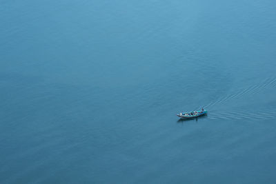 High angle view of sailboat sailing in sea