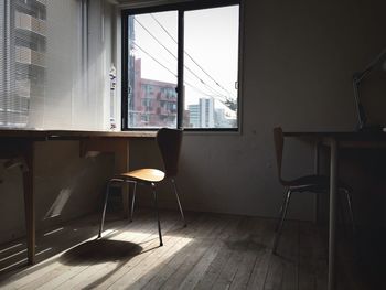 Chairs and tables in corner of office