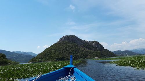 Scenic view of mountains against blue sky