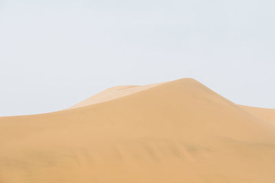 Scenic view of desert against clear sky