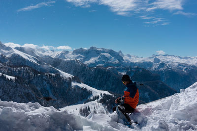 Tourists on snow covered landscape