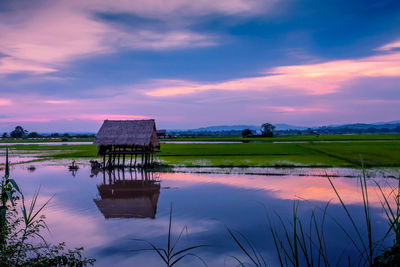 Scenic view of lake against sky during sunset