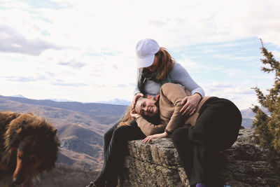 Mother and daughter spending leisure time on mountain