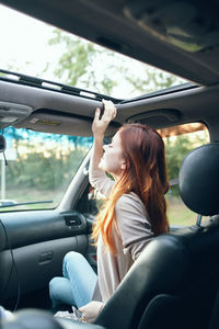 Woman sitting in car