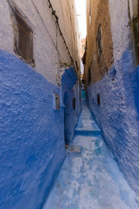 Narrow alley amidst buildings in town