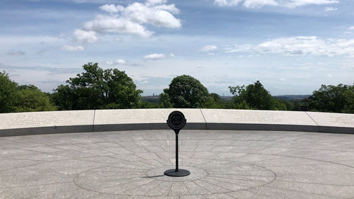 View of lamp on wall against trees