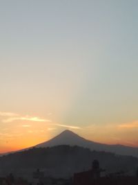 Silhouette of mountain during sunset