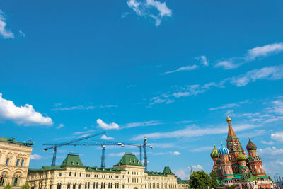 Low angle view of buildings against blue sky