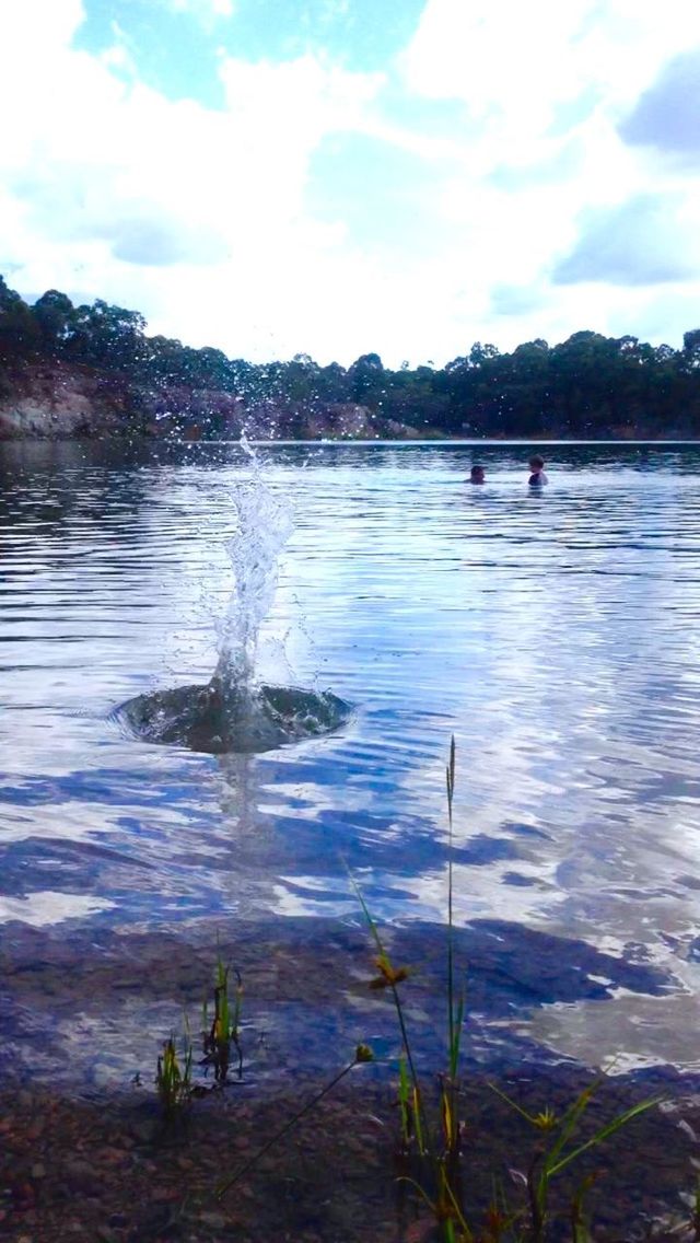 water, sky, lake, tranquil scene, tranquility, reflection, beauty in nature, scenics, cloud - sky, nature, plant, cloud, rippled, idyllic, rock - object, lakeshore, river, non-urban scene, outdoors, cloudy