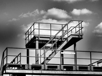 Low angle view of building against cloudy sky