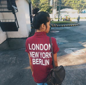 Girl with text on street in city